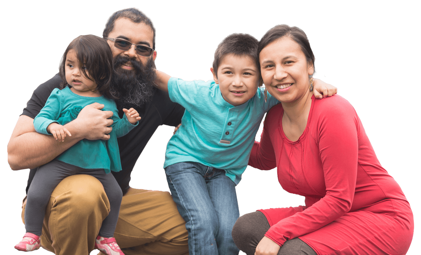 A father, mother, and two young children pose together as a family.